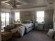 Luxurious main bedroom with plush bed and sitting area at 9859 Winnington St, Orlando, FL 32832