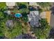 Aerial view showing house, pool, and surrounding landscape at 1333 Orchid Ave, Winter Park, FL 32789