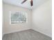 Simple bedroom with large window and neutral decor at 1333 Orchid Ave, Winter Park, FL 32789