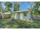 Light green guest house with white door and windows at 1333 Orchid Ave, Winter Park, FL 32789