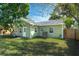 Newly painted light green house with a white door and windows at 1333 Orchid Ave, Winter Park, FL 32789