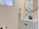 Updated bathroom with a vanity and a large mirror at 15241 Sunrise Grove Ct, Winter Garden, FL 34787