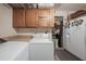 Bright laundry room with washer, dryer, and cabinets at 328 Sterling Rose Ct, Apopka, FL 32703