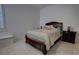 Bedroom with a queen-size bed, nightstand, and window shutters at 366 Chinook Cir, Lake Mary, FL 32746