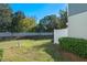 Private backyard with grassy area and white vinyl fence at 3932 White Birch Run, Winter Springs, FL 32708