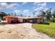 House exterior featuring a large yard and carport at 4028 Wendy Dr, Orlando, FL 32808