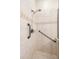 Walk-in shower with grab bars and tile surround at 4232 Isle Vista Ave, Belle Isle, FL 32812