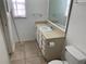 Bathroom with vanity, sink, and toilet at 496 Raymond Ave, Longwood, FL 32750