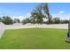 Large fenced backyard with lush green grass at 626 Nw 9Th Ave, Webster, FL 33597