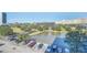 Arial view of a lake, parking lot, and surrounding buildings at 7383 Universal Blvd # 512, Orlando, FL 32819
