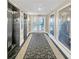 Well-lit hallway with elevators and stylish artwork at 7383 Universal Blvd # 512, Orlando, FL 32819