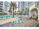 Community hot tub area next to the pool and lounge chairs at 7383 Universal Blvd # 512, Orlando, FL 32819