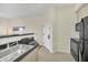 Kitchen with stainless steel sink and black appliances at 7383 Universal Blvd # 512, Orlando, FL 32819