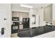Well-equipped kitchen with black appliances at 7383 Universal Blvd # 512, Orlando, FL 32819