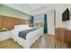 King-size bed with wood feature wall at 7383 Universal Blvd # 512, Orlando, FL 32819