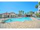 Community pool with lounge chairs and a pool bar at 7383 Universal Blvd # 512, Orlando, FL 32819