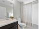 Small bathroom with single vanity and tub shower at 824 Maumee St, Orlando, FL 32828