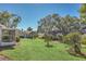 Landscaped backyard with a view of neighboring homes at 1084 Villa Ln # 72, Apopka, FL 32712
