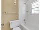 Clean bathroom with white tile, bathtub, and toilet at 1084 Villa Ln # 72, Apopka, FL 32712