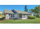 House exterior showcasing gray siding and screened porch at 1084 Villa Ln # 72, Apopka, FL 32712