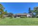 House exterior with green lawn and screened porch at 1084 Villa Ln # 72, Apopka, FL 32712