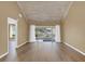 Spacious living room with wood-look flooring and sliding glass doors at 1084 Villa Ln # 72, Apopka, FL 32712