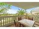 Private balcony with table and chairs, offering scenic golf course views at 1370 Centre Court Ridge Dr # 304, Kissimmee, FL 34747