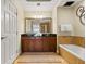 Large bathroom with double vanity, soaking tub, and walk-in shower at 1370 Centre Court Ridge Dr # 304, Kissimmee, FL 34747