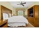 Main bedroom with king-size bed, a ceiling fan, and a private balcony at 1370 Centre Court Ridge Dr # 304, Kissimmee, FL 34747