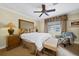 Cozy bedroom with a comfortable bed and seating area at 1370 Centre Court Ridge Dr # 304, Kissimmee, FL 34747