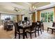 Bright dining area with a dark wood table and seating for six at 1370 Centre Court Ridge Dr # 304, Kissimmee, FL 34747