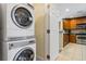 Stackable washer and dryer with kitchen view at 1370 Centre Court Ridge Dr # 304, Kissimmee, FL 34747
