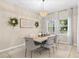 Elegant dining room featuring a large wooden table and chandelier at 15687 Citrus Heights Dr, Winter Garden, FL 34787