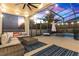 Cozy screened-in patio with seating area adjacent to the pool at 15687 Citrus Heights Dr, Winter Garden, FL 34787