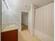 Bathroom with tub shower, granite vanity, and tiled floor at 225 W Seminole Blvd # 206, Sanford, FL 32771