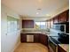 Modern kitchen with granite counters and stainless steel appliances at 225 W Seminole Blvd # 206, Sanford, FL 32771