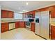 Modern kitchen with stainless steel appliances and wood cabinets at 225 W Seminole Blvd # 206, Sanford, FL 32771