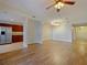 Open living room with hardwood floors and kitchen access at 225 W Seminole Blvd # 206, Sanford, FL 32771