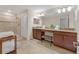 Large bathroom with double sinks, soaking tub, and walk-in shower at 2948 Banana Palm Dr, Kissimmee, FL 34747