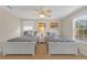 Guest bedroom with two twin beds and beach decor at 2948 Banana Palm Dr, Kissimmee, FL 34747