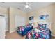 Bedroom with two twin beds and ample closet space at 2948 Banana Palm Dr, Kissimmee, FL 34747