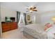 Primary bedroom with king bed and dresser at 2948 Banana Palm Dr, Kissimmee, FL 34747