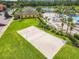 Outdoor sand volleyball court with surrounding green space at 2948 Banana Palm Dr, Kissimmee, FL 34747