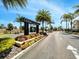 Welcoming entrance to community with landscaping and signage at 3205 Gold Ln, Kissimmee, FL 34747