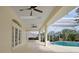 Spacious covered patio with pool view and ceiling fans at 349 Plantation Club Dr, Debary, FL 32713