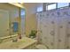 Clean bathroom with shower and floral accents at 3555 Maribella Dr, New Smyrna Beach, FL 32168