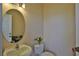 Simple powder room with single sink and toilet at 3555 Maribella Dr, New Smyrna Beach, FL 32168