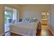 Bright bedroom with access to bathroom and patio at 3555 Maribella Dr, New Smyrna Beach, FL 32168