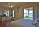 Spacious Primary bedroom with lake view and wood floors at 3555 Maribella Dr, New Smyrna Beach, FL 32168