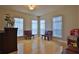Bright living room with hardwood floors and large windows at 3555 Maribella Dr, New Smyrna Beach, FL 32168